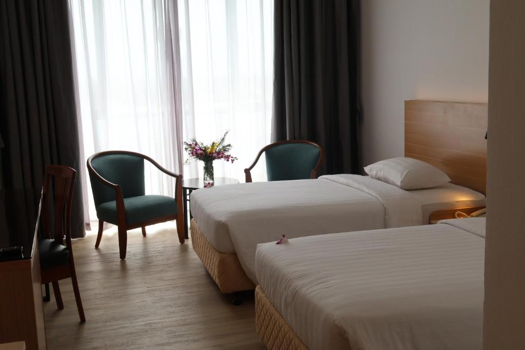 Postel nebo postele na pokoji v ubytování Crystal Crown Hotel Harbour View, Port Klang