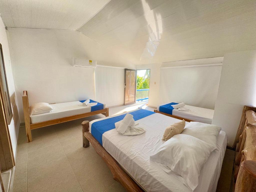 Postel nebo postele na pokoji v ubytování Tintipan Hotel