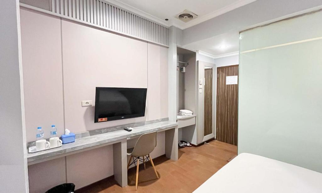 TV a/nebo společenská místnost v ubytování G-Hotel Pontianak