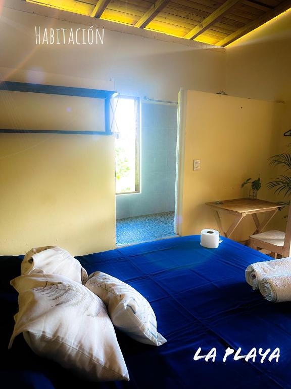 Ένα ή περισσότερα κρεβάτια σε δωμάτιο στο Hotel La Playa