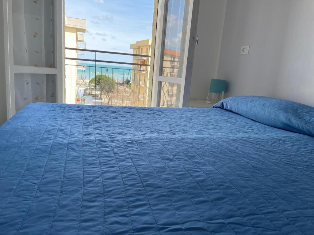 Postel nebo postele na pokoji v ubytování Residenza Lido adriano baia tartaruga