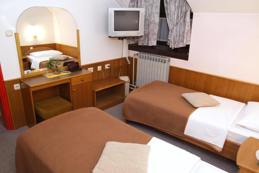 Postel nebo postele na pokoji v ubytování Guest house Royal