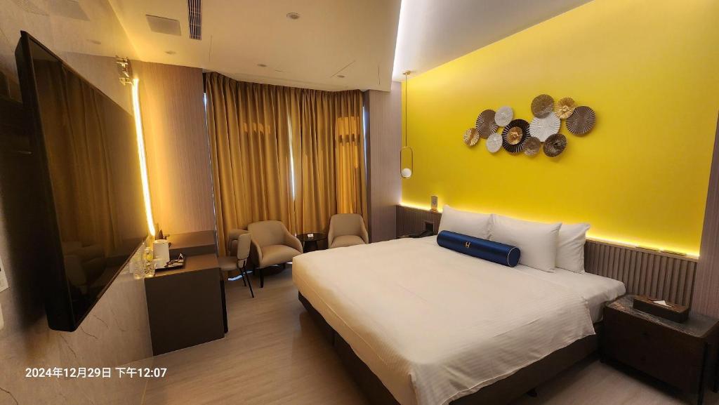 Postel nebo postele na pokoji v ubytování Jiati Business Motel