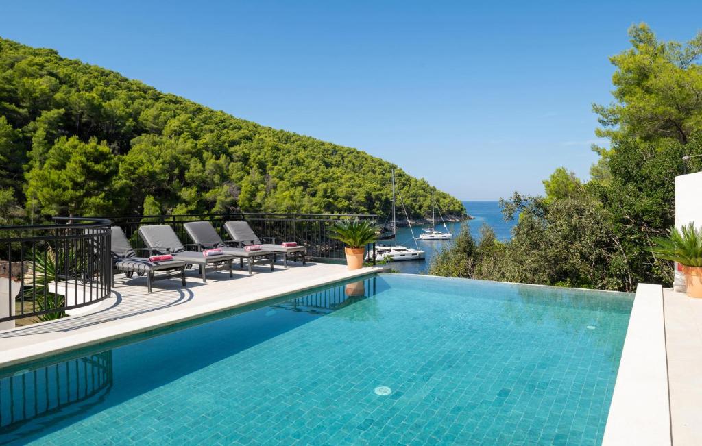 a swimming pool with a view of the ocean at Villa Sea Escape in Brusje
