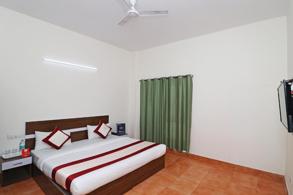 Postel nebo postele na pokoji v ubytování Hotel O Prime Plaza