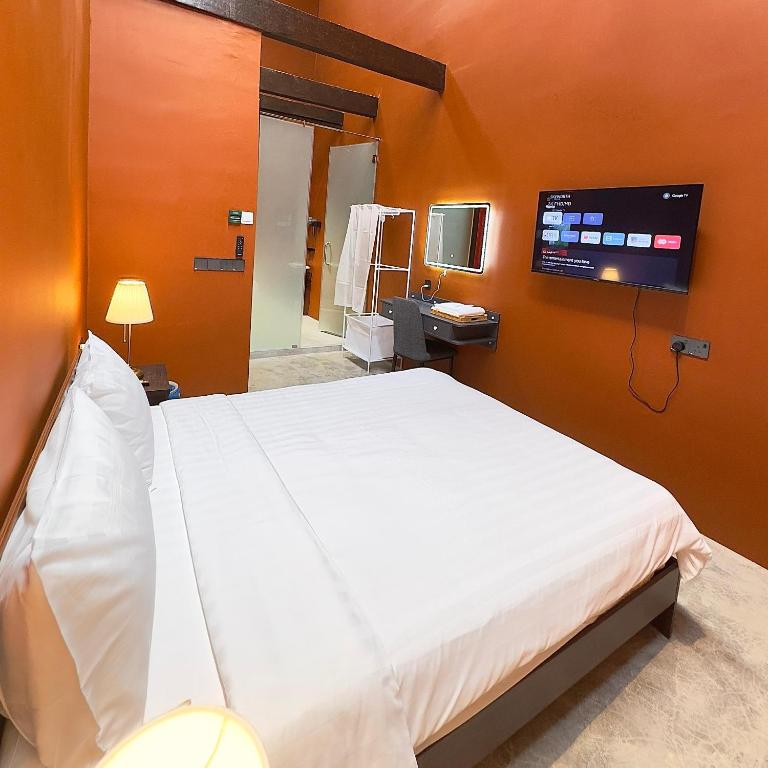 Postel nebo postele na pokoji v ubytování Hotel Ban Sheng Teik