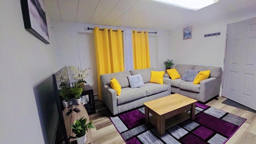 a living room with a couch and a table at Fairbanks Rafiki Unit 2 in Fairbanks