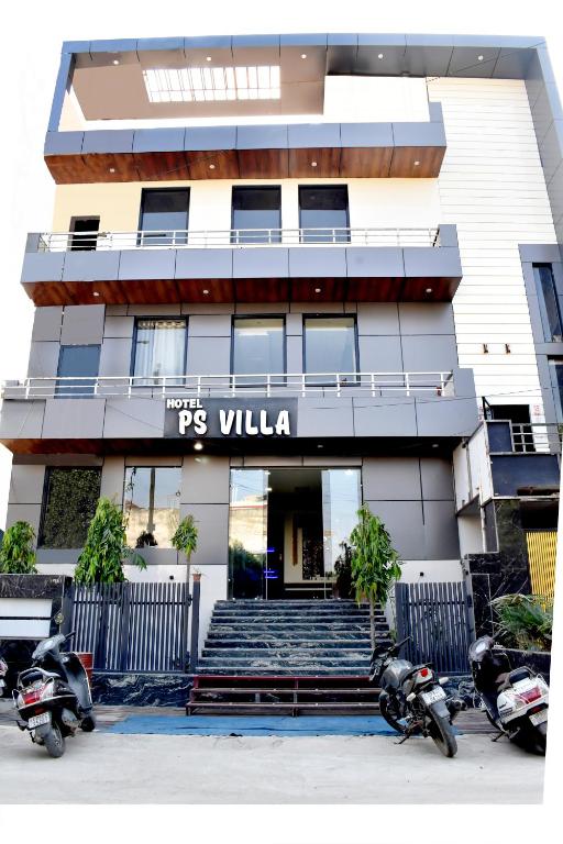 two motorcycles parked in front of a building at Hotel P S Villa & Banquet in Agra