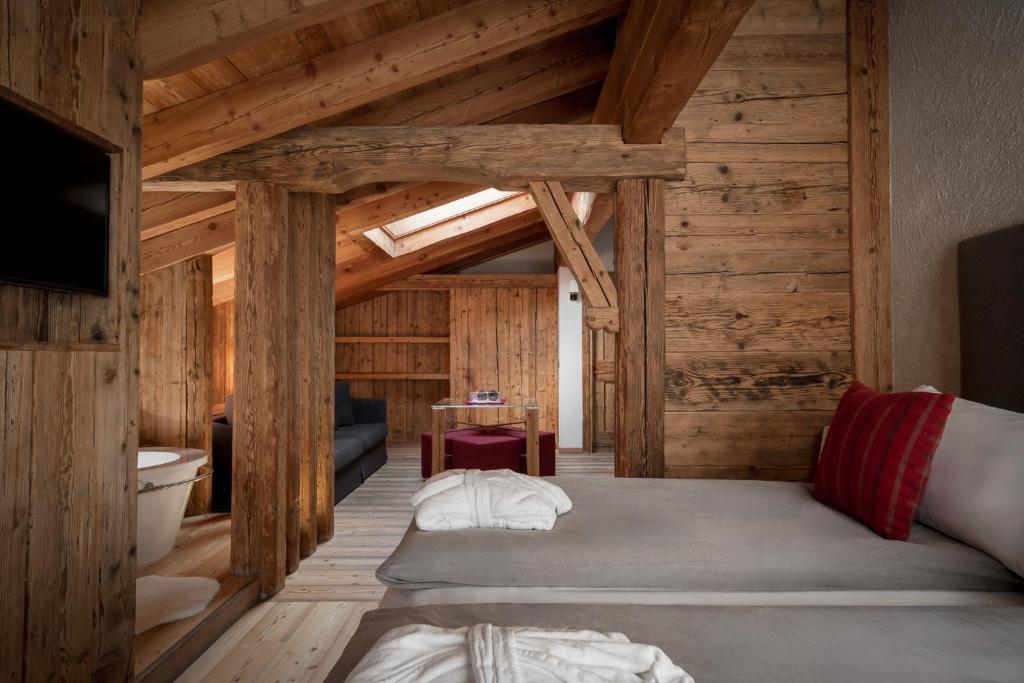 Postel nebo postele na pokoji v ubytování Alpen Hotel Chalet