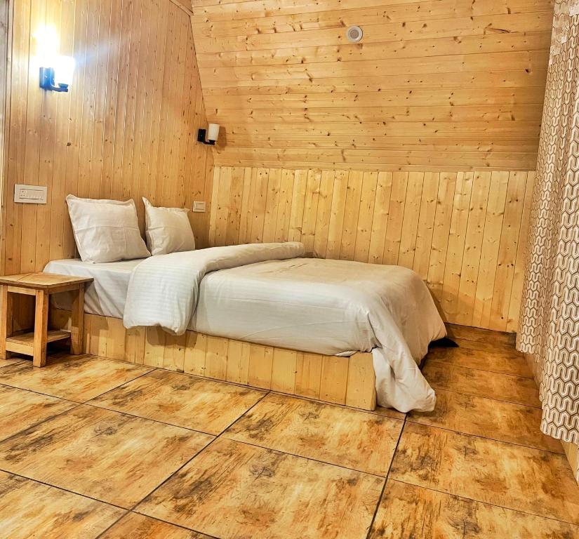 Postel nebo postele na pokoji v ubytování Winter Soul Cottages