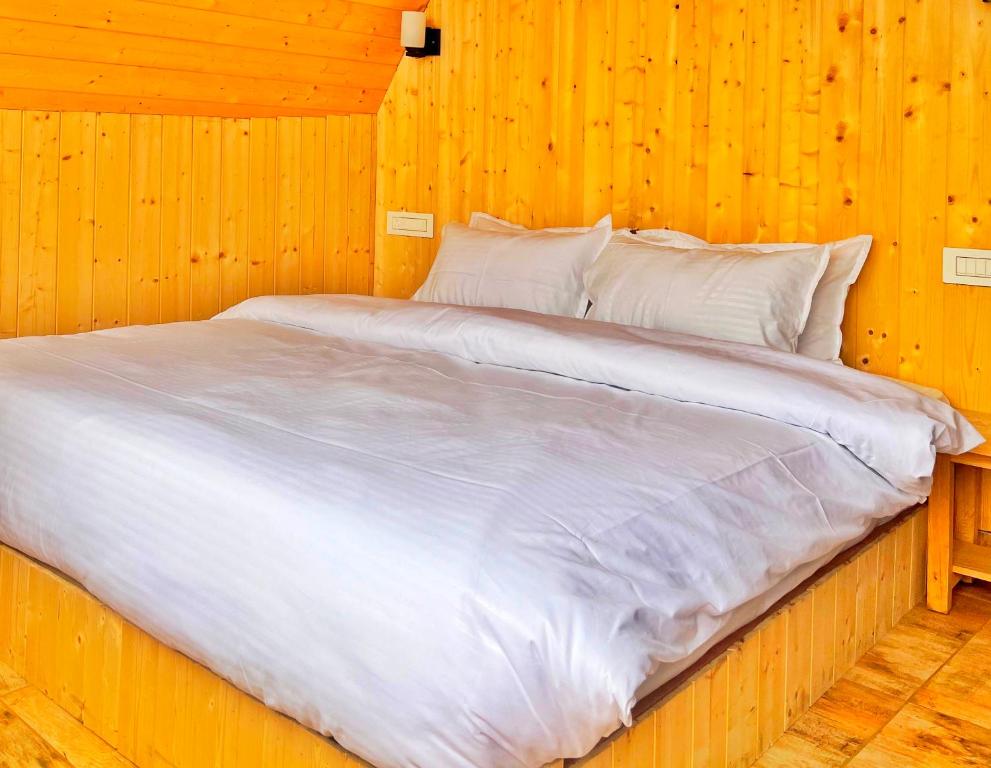 Postel nebo postele na pokoji v ubytování Winter Soul Cottages