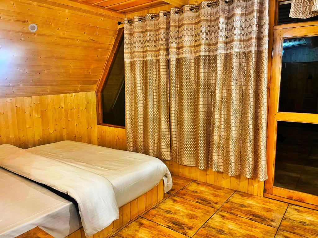 Postel nebo postele na pokoji v ubytování Winter Soul Cottages