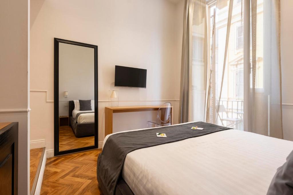 Postel nebo postele na pokoji v ubytování Vanity Navona