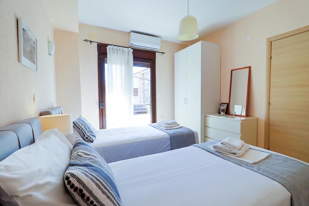 Postel nebo postele na pokoji v ubytování Guedin Sea Side Maisonette, Nikiti