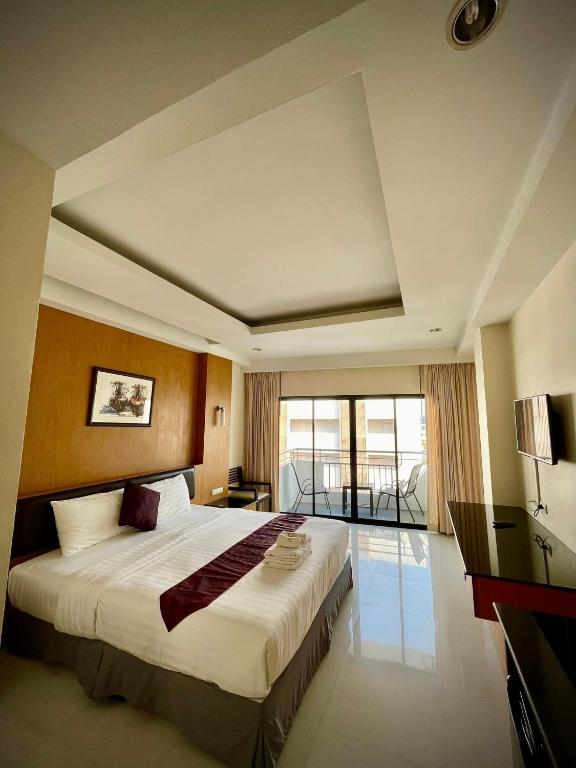 Postel nebo postele na pokoji v ubytování My PLACE HUA-HIN HOTEL