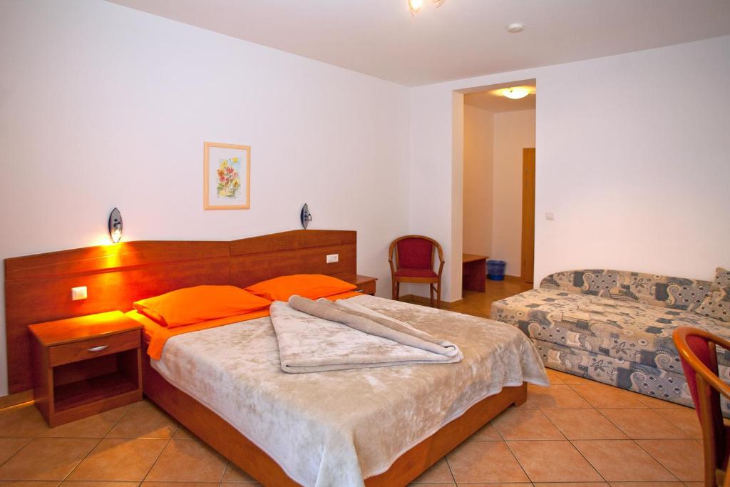 Postel nebo postele na pokoji v ubytování Guesthouse Villa Adria