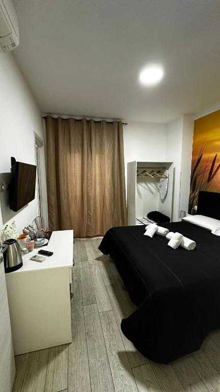 Łóżko lub łóżka w pokoju w obiekcie Napoli Relais