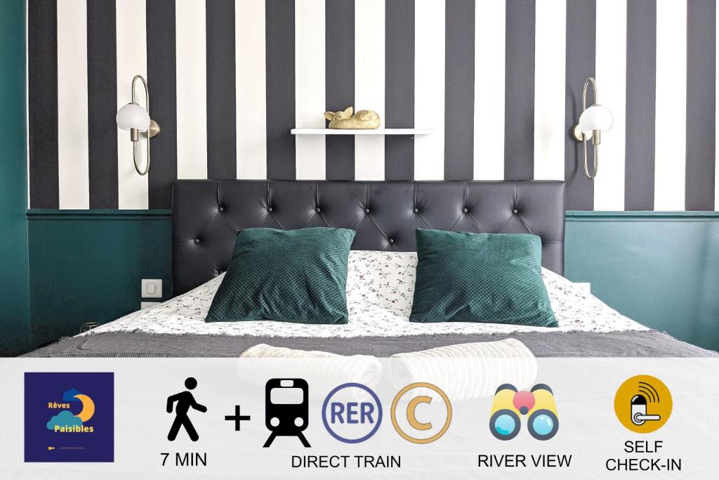 a bedroom with a bed with a black and white striped wall at Rêves Paisibles - Choisy - Emeuraude in Choisy-le-Roi