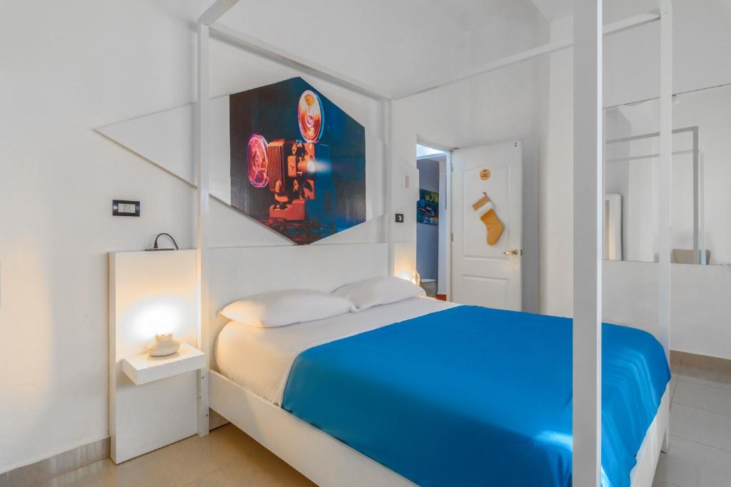 Postel nebo postele na pokoji v ubytování Hostal Mamà Mambò - Zona Colonial