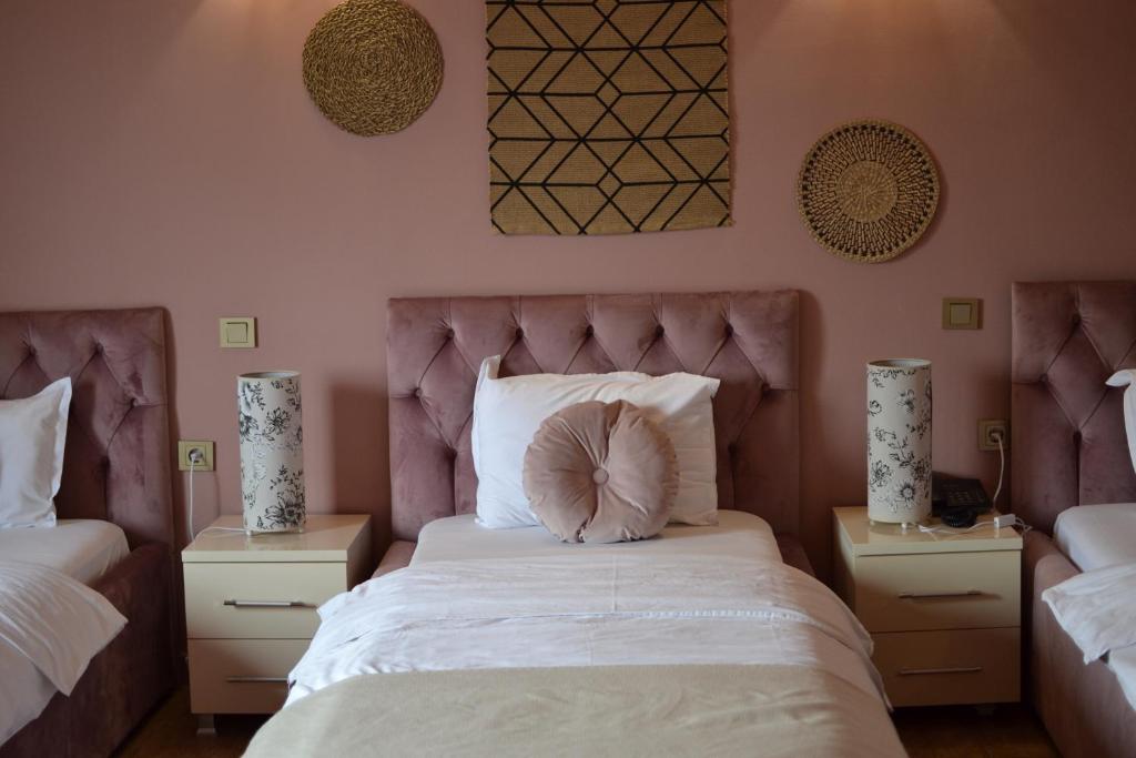 Postel nebo postele na pokoji v ubytování Hotel Pamela Concept