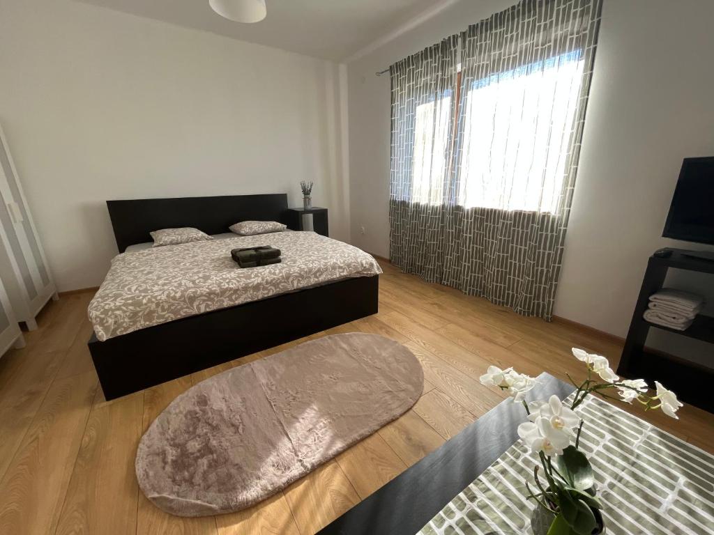 Postel nebo postele na pokoji v ubytování BALU CITY APARTMeNT