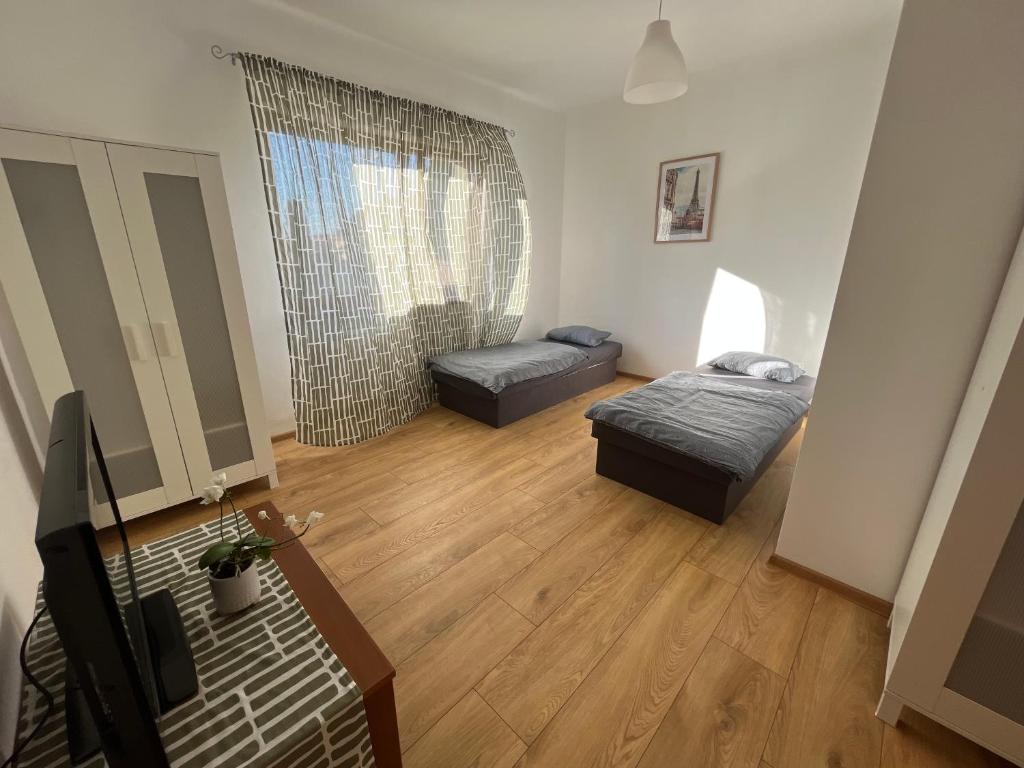 Postel nebo postele na pokoji v ubytování BALU CITY APARTMeNT