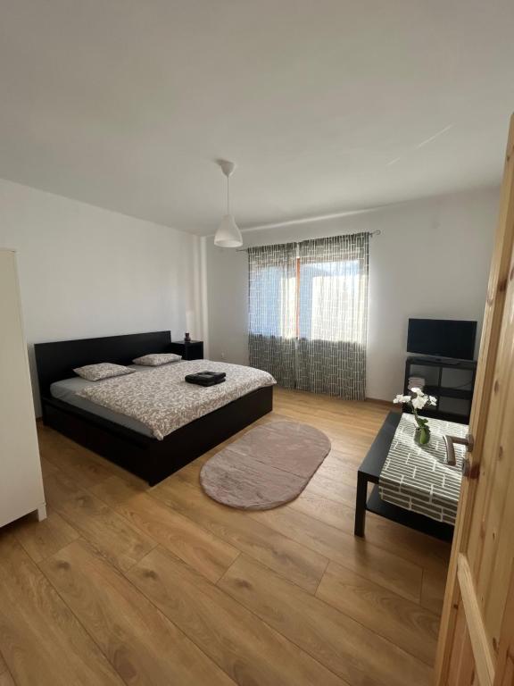 Postel nebo postele na pokoji v ubytování BALU CITY APARTMeNT