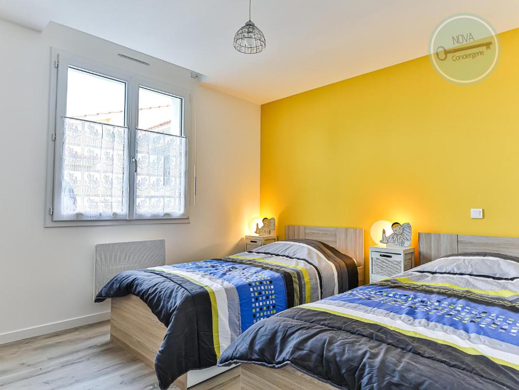 Posteľ alebo postele v izbe v ubytovaní Maison Ker Mona
