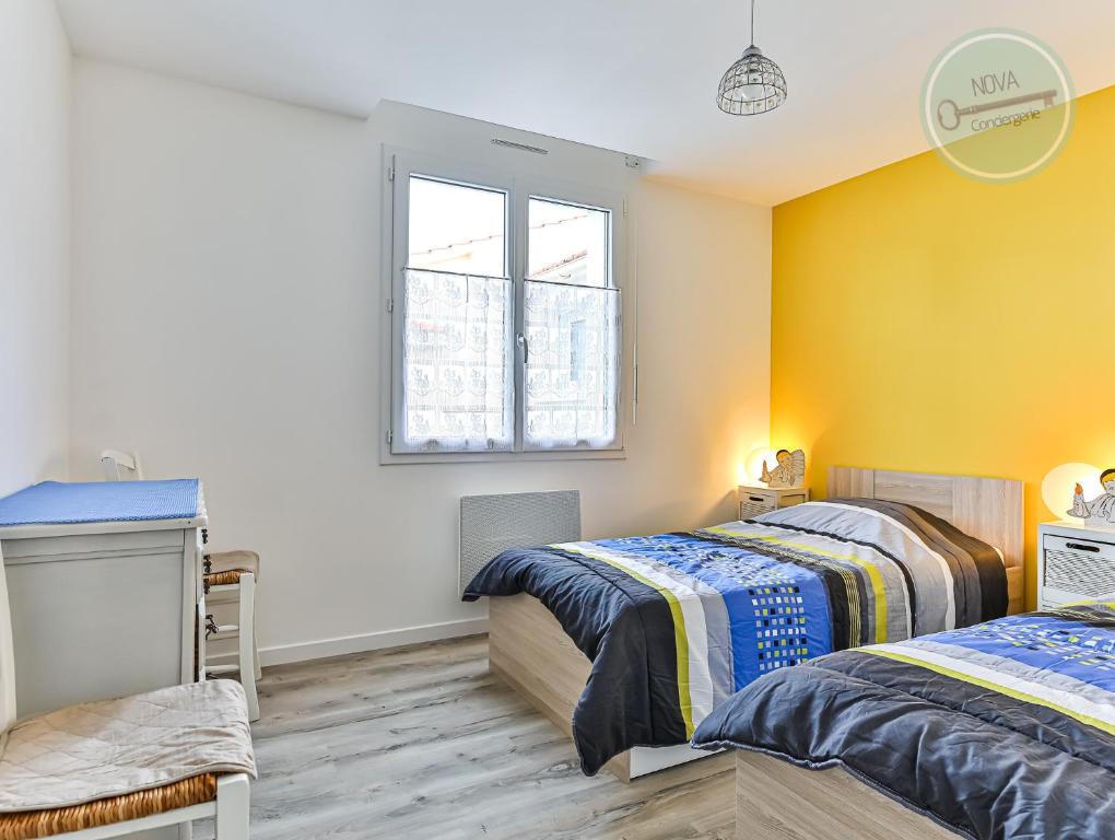 Posteľ alebo postele v izbe v ubytovaní Maison Ker Mona