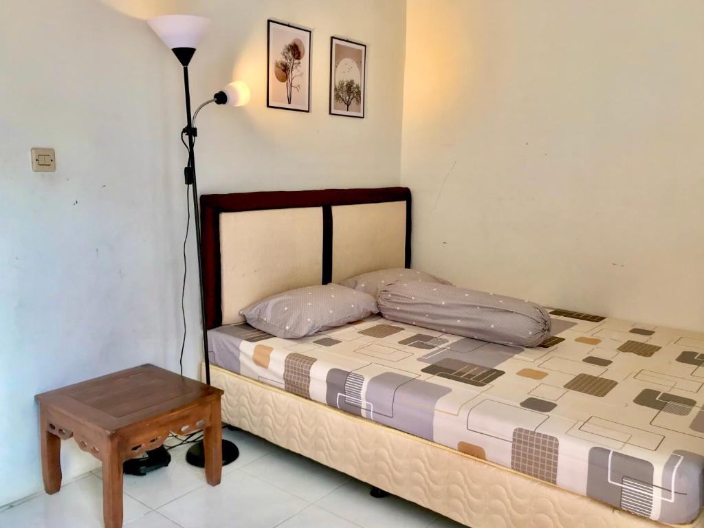 Ένα ή περισσότερα κρεβάτια σε δωμάτιο στο Grania Homestay