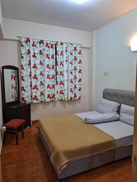 Postel nebo postele na pokoji v ubytování NKK Holiday Suits