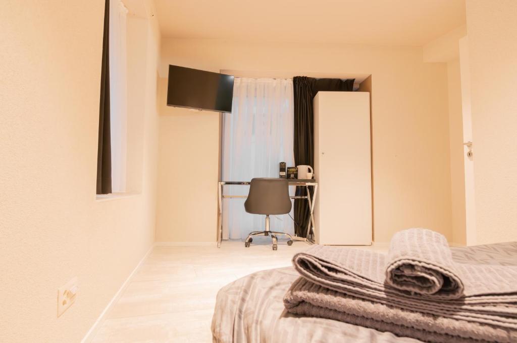 Postel nebo postele na pokoji v ubytování Hotel Rütli am Bahnhof Rüti ZH