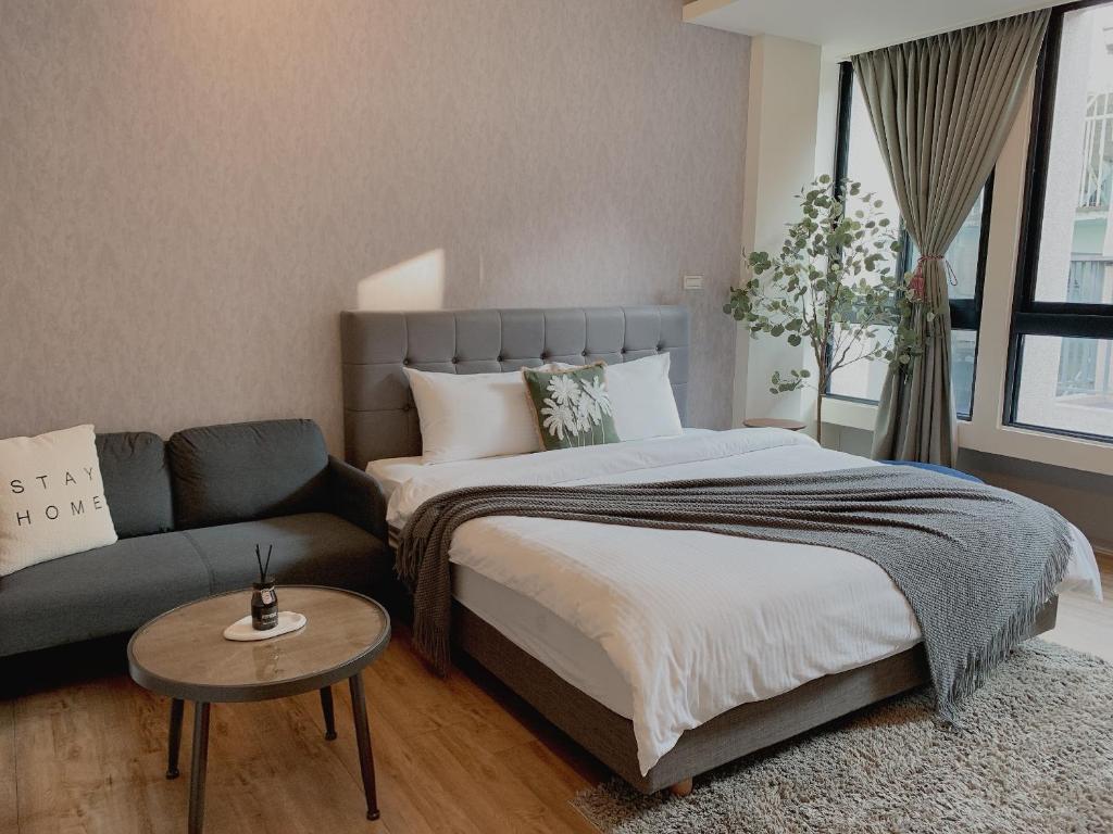 Postel nebo postele na pokoji v ubytování Minilove Homestay
