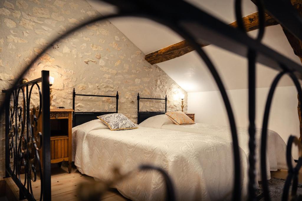 Postel nebo postele na pokoji v ubytování Ets CAPMASIL - chambre 1920