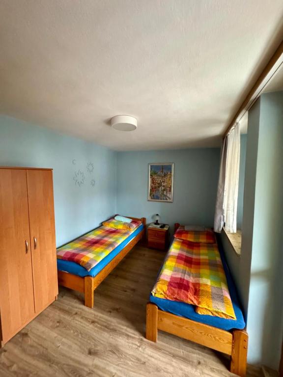Posteľ alebo postele v izbe v ubytovaní Willa Słoneczko