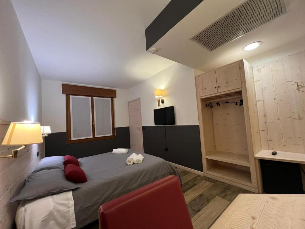 Postel nebo postele na pokoji v ubytování Damodoro Hotel