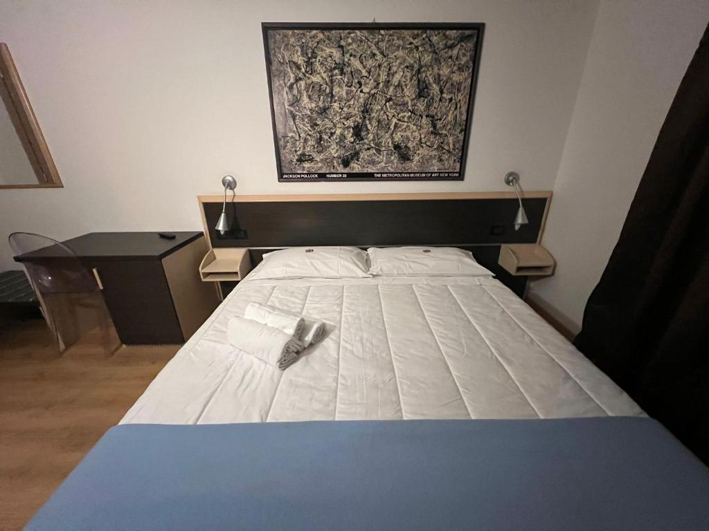 Postel nebo postele na pokoji v ubytování Damodoro Hotel