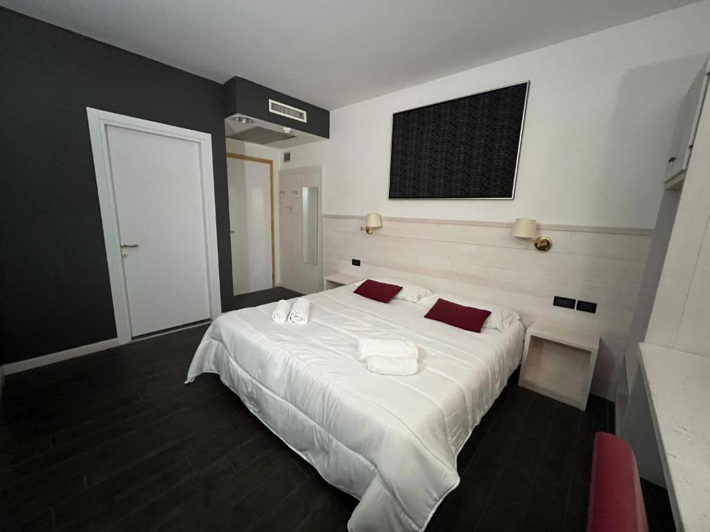 Postel nebo postele na pokoji v ubytování Damodoro Hotel