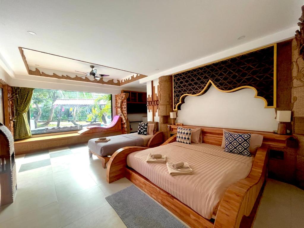 Postel nebo postele na pokoji v ubytování AC 2 Resort