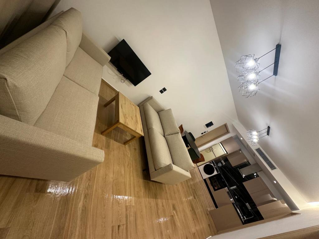 TV a/nebo společenská místnost v ubytování Suites Kozi