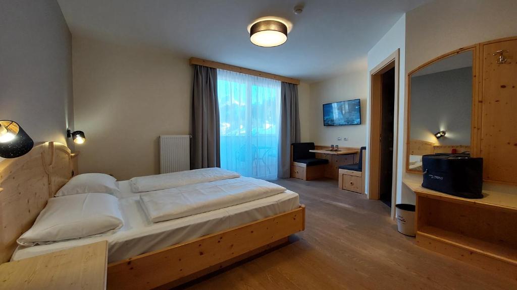 TV a/nebo společenská místnost v ubytování Hotel Cristallo