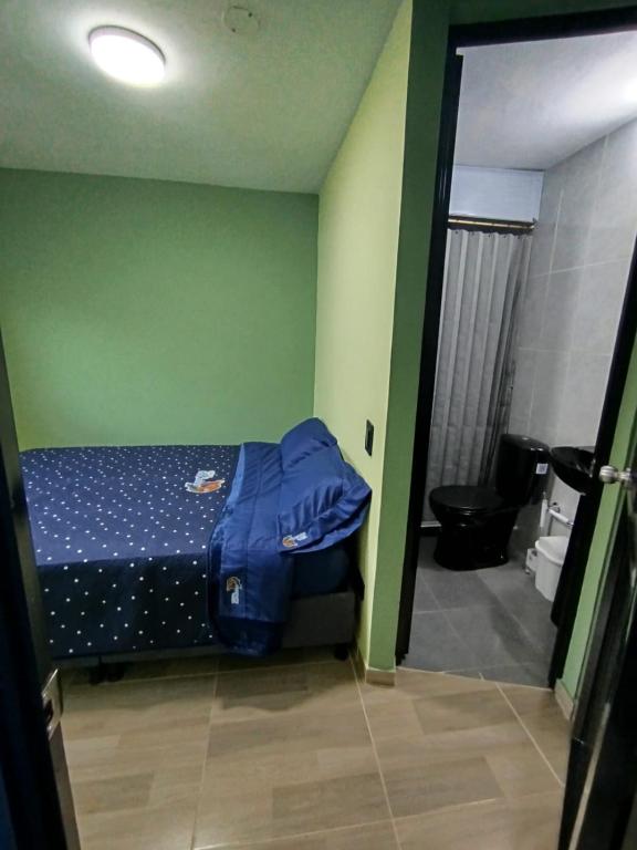 Voodi või voodid majutusasutuse Hostal mil colores toas