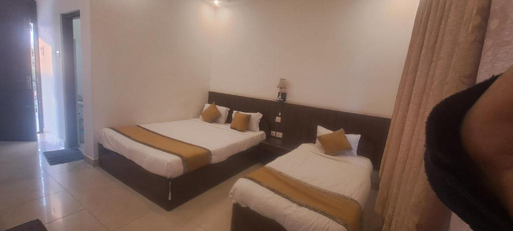 Postel nebo postele na pokoji v ubytování sakya guest house
