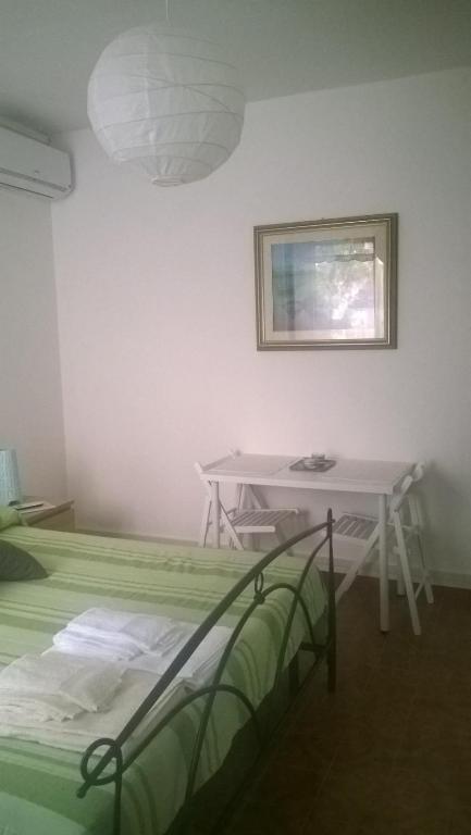 Postel nebo postele na pokoji v ubytování Affittacamere Fiorella