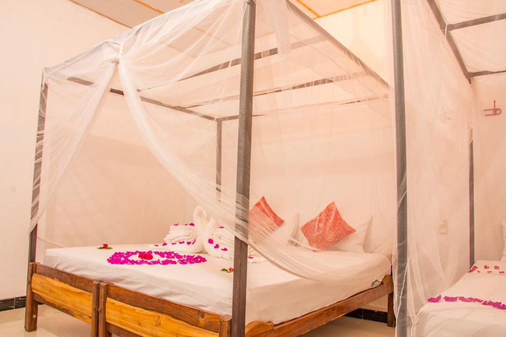 Postel nebo postele na pokoji v ubytování Relax Beach Arugambay