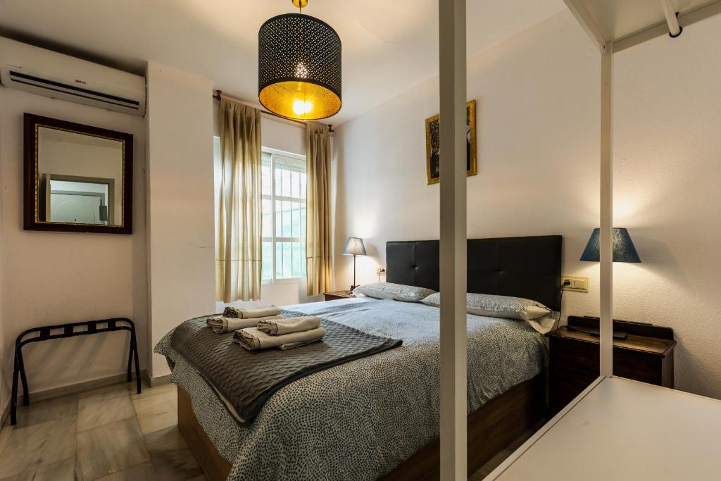 Cama o camas de una habitación en Apartamentos Ruta de la Sierra