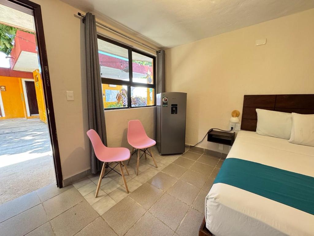 Postel nebo postele na pokoji v ubytování Hotel Caribe