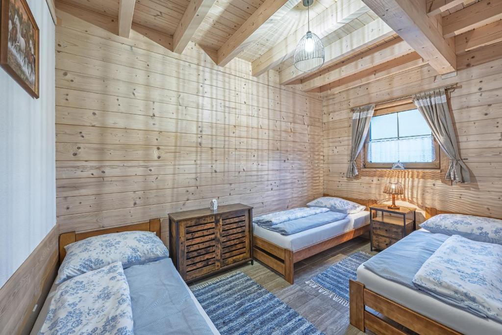 Postel nebo postele na pokoji v ubytování Domky Čučoriedky