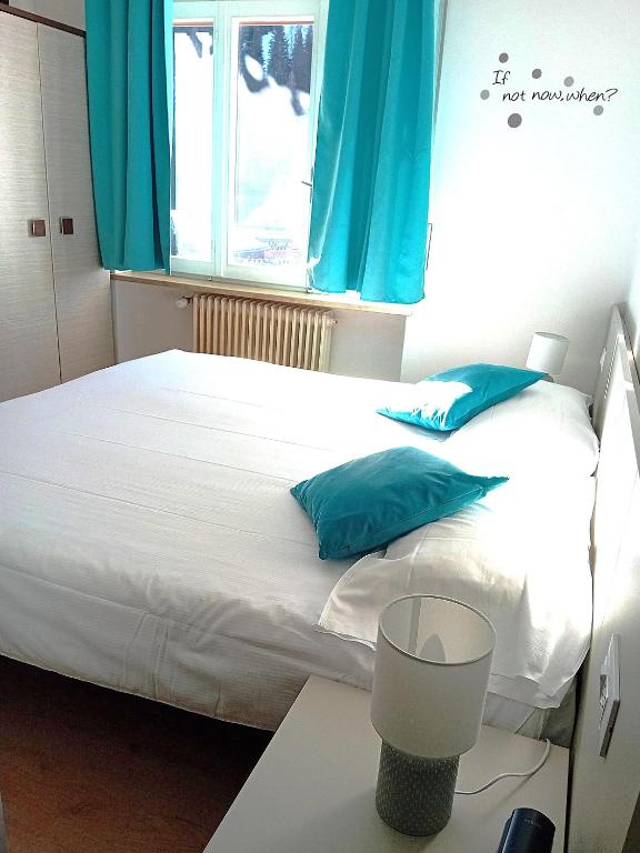 Postelja oz. postelje v sobi nastanitve Hotel B&B Lorenzini Ski