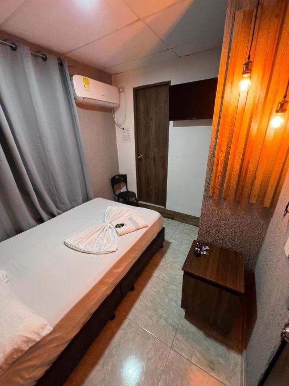 Postel nebo postele na pokoji v ubytování Hotel Almalu